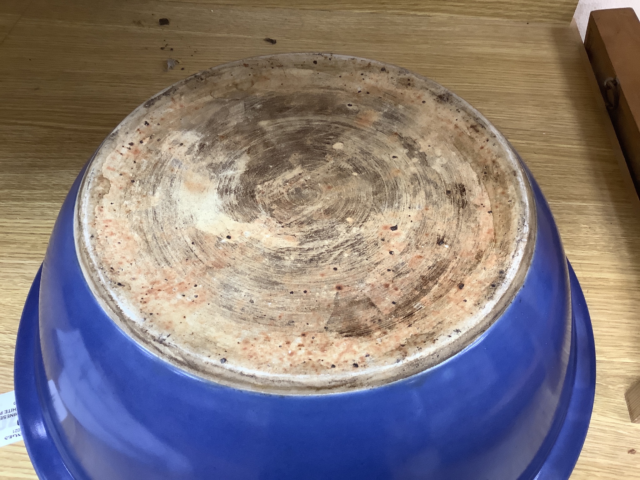 A large Chinese blue and white porcelain basin, lightly relief moulded with plants, 40cm